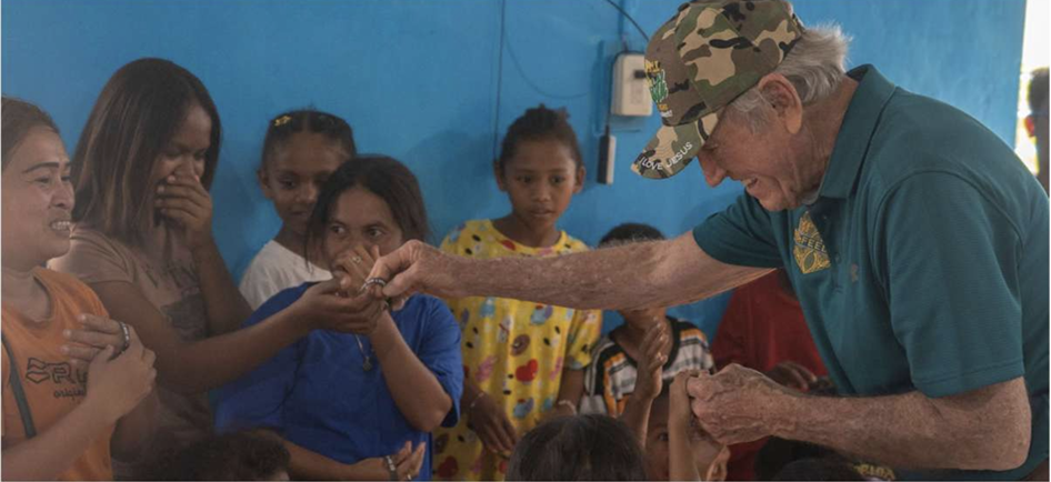 Mission team member interacting with children
