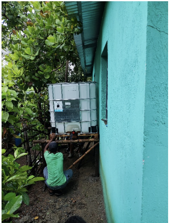 Water tank being installed beside Keith Chapel