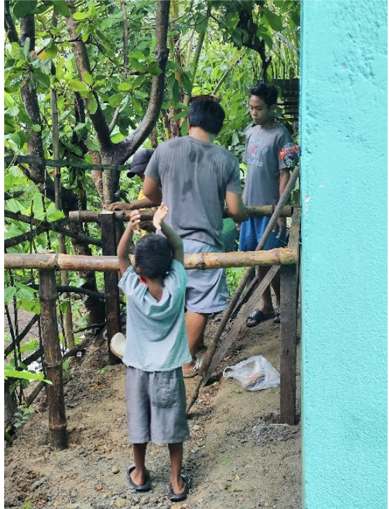 Community members helping with the water tank installation
