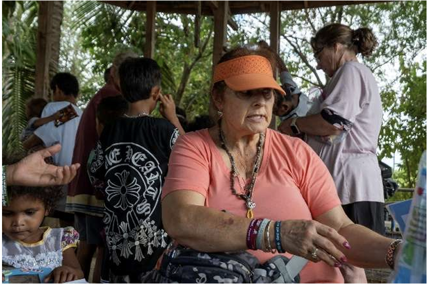 Community gathering with mission team members