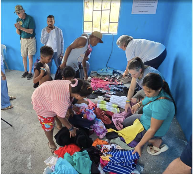 Community members selecting donated clothes